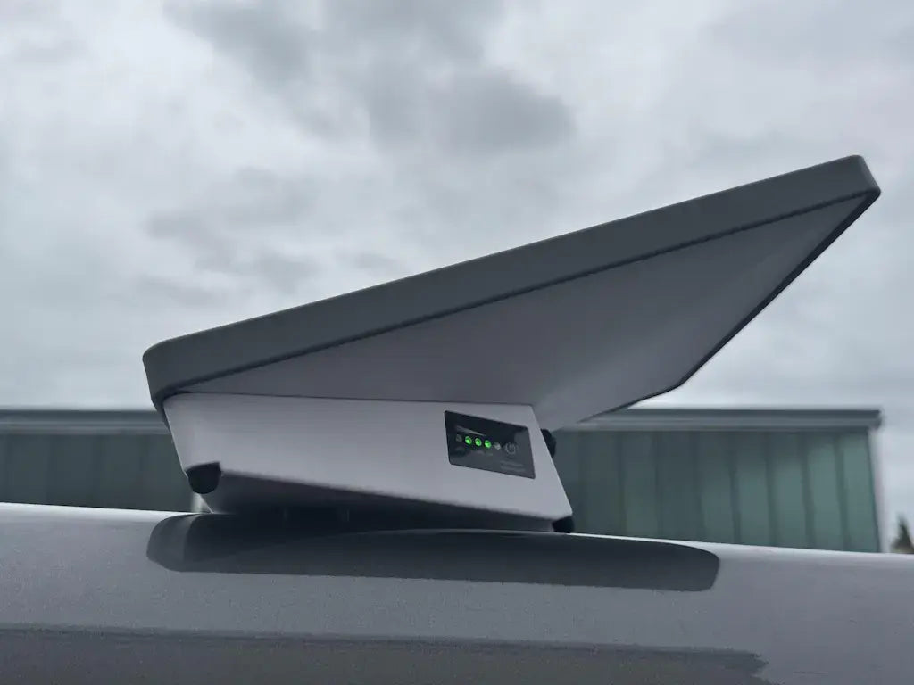 Outdoor camping using Starlink Mini battery mounted on the car roof