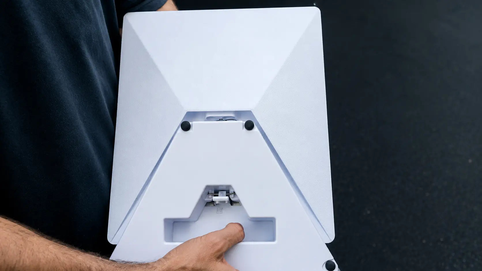 Rear view of a Starlink Mini with a LiFirst clip-on battery system securely installed and held for portable deployment.